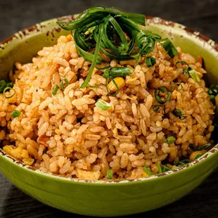 a bowl of rice with spinach