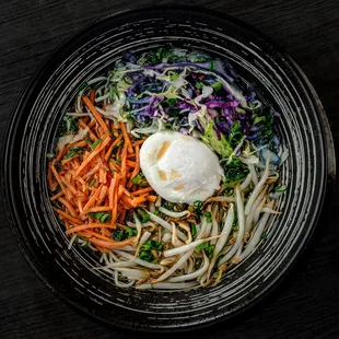 a bowl of noodles and carrots