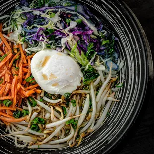 an overhead view of a bowl of food