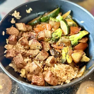 Hibachi Steak over fried rice with vegetables