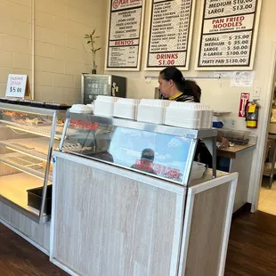 a woman behind the counter