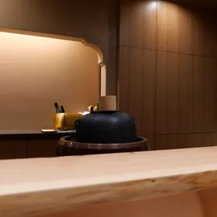 a view of a kitchen counter with a vase and a vase on it
