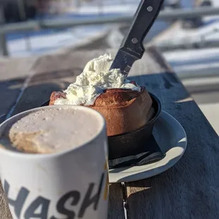 Mocha and cinnamon roll with a Colorado view