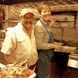 Members Rob and Shannon donating their skills in preparing a gourmet dinner for a Becoming An Outdoors Women group.