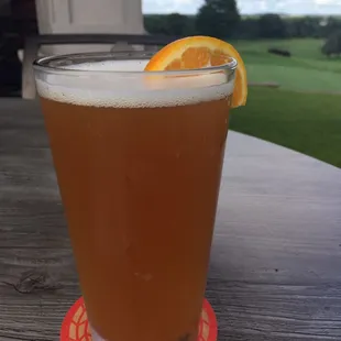 a glass of beer on a table