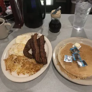 Pancake Platter with 5 strips of bacon hash browns and 2 over easy eggs. 8.99. Couldn't finish it all and needed a nap.