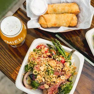 a plate of food and a glass of beer