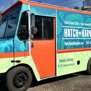a colorful food truck parked in a parking lot