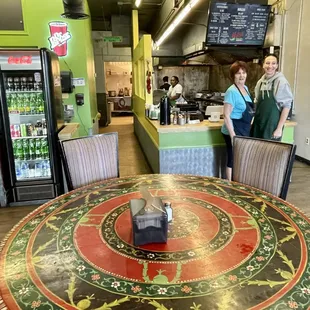 two people standing at the counter