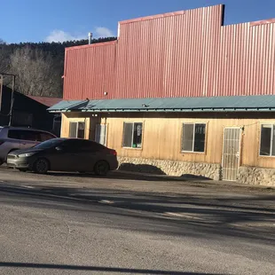 a car parked in front of a restaurant