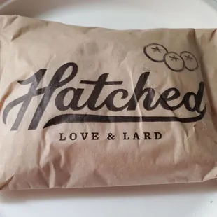 a bag of love and lard on a plate