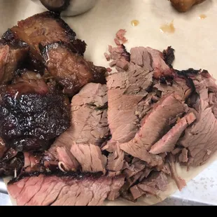 a plate of meat and sides