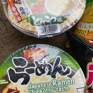 two bowls of ramen and a bag of ramen