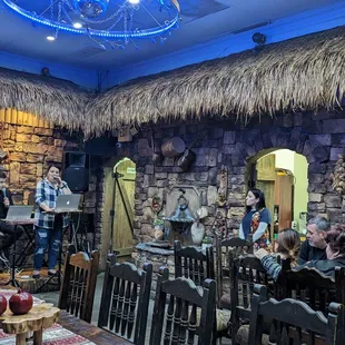 a group of people sitting around a table