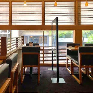 a view of a dining area with tables and chairs