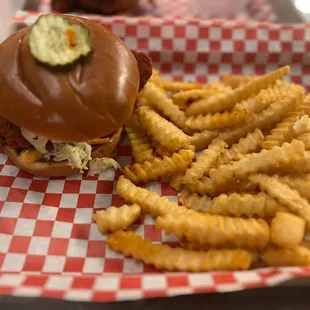 Hot chicken sandwich with fries
