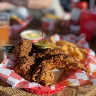 a basket of fried chicken and fries