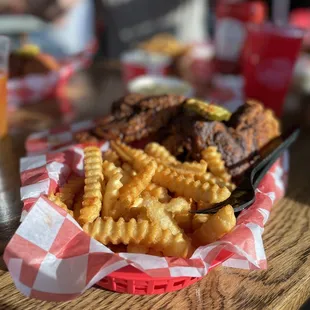 a basket of fried chicken and fries