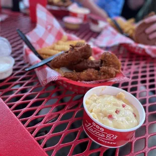 Hot chicken tenders with fries and Mac and cheese