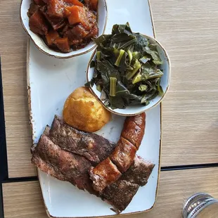 2 meat plate, ribs, and sausage  with collards and yams.