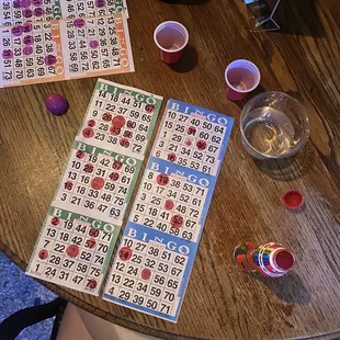 a table full of bingo cards