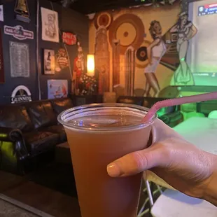 a person holding a drink