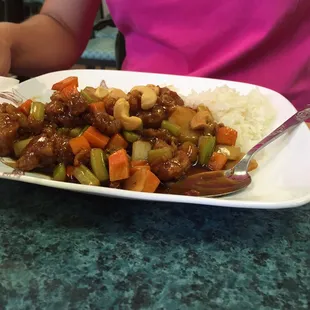 a plate of food with rice and vegetables