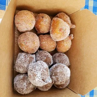 A box of 15 Taro and fruity pebbles mochisadas for $20