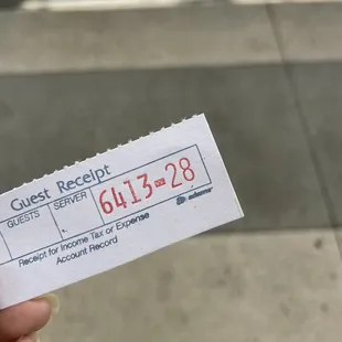 a person holding a ticket