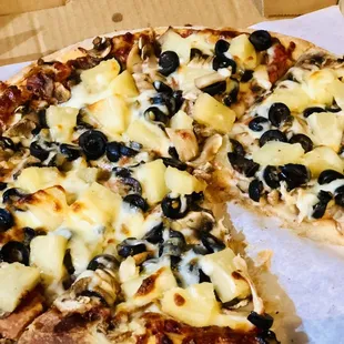 Toppings: pineapple, mushroom, olives