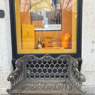 a bench in front of a window