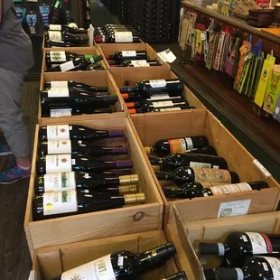 rows of wine bottles in wooden boxes