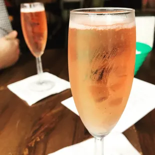 a glass of champagne on a table