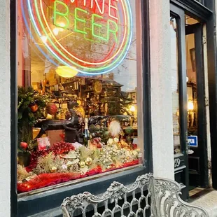 a bench in front of a wine bar