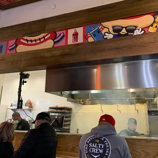 a man and a woman in a kitchen