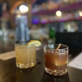 two cocktails on a bar counter