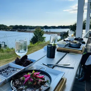 a plate of food and a glass of wine