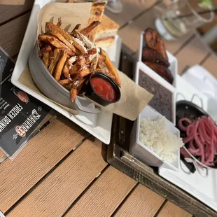 a plate of french fries and a sandwich