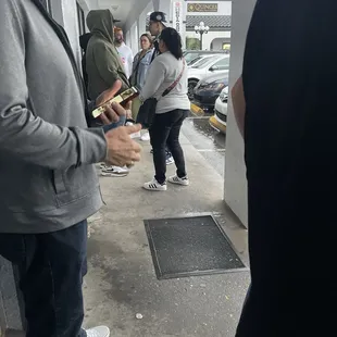 This is all the people Standing outside in the rain.