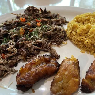 Vaca frita  with yellow rice and plantains