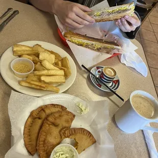 Yuca fritas, Chicken empanada, cafe con leche, cordatito, Cuban special sandwich (Roast Pork)