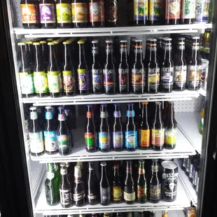 a refrigerator full of beer bottles