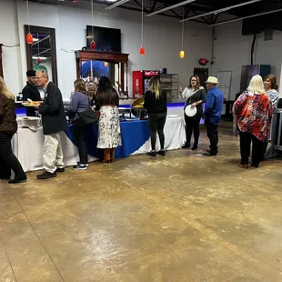 a group of people standing in a room