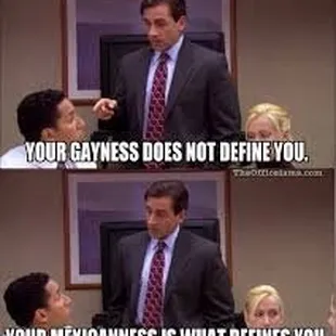 a man in a suit and tie talking to a woman