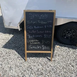 a chalkboard sign for a food truck