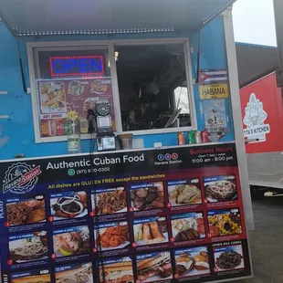 a man standing in front of a food truck
