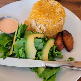 Arroz con pollo with knife for scale.  Great taste and the pile of rice is about two cups worth.