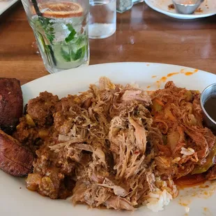 Shredded Pork, Beef Picadillo &amp; Ropa Vieja. Served on a bed of white rice, Cuban-style black beans &amp; Maduros.