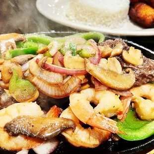 a steak and vegetables in a skillet