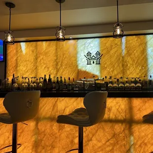 a bar with three bar stools